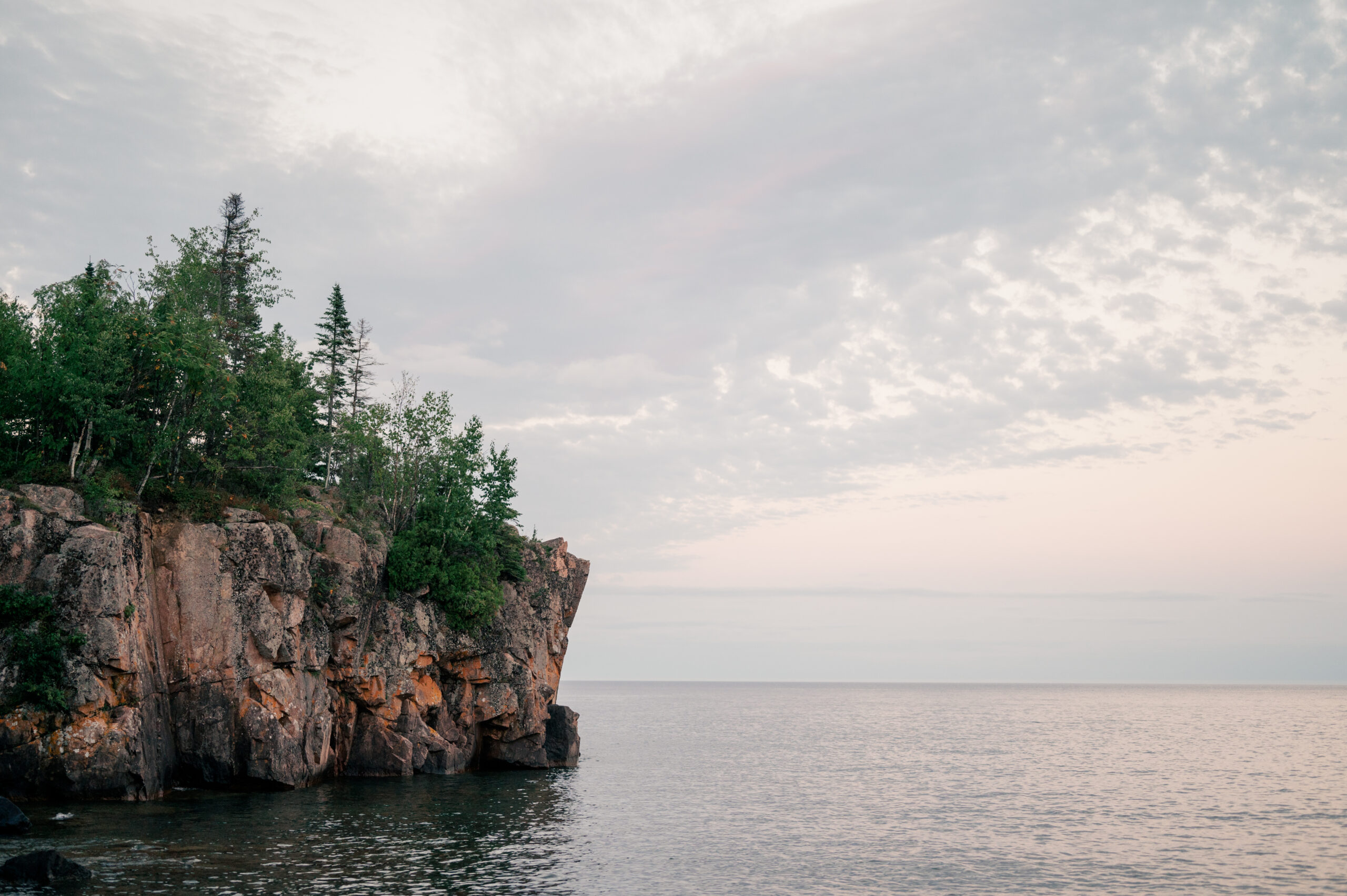 Minnesota's north shore cliffs above water by Rule Creative Co