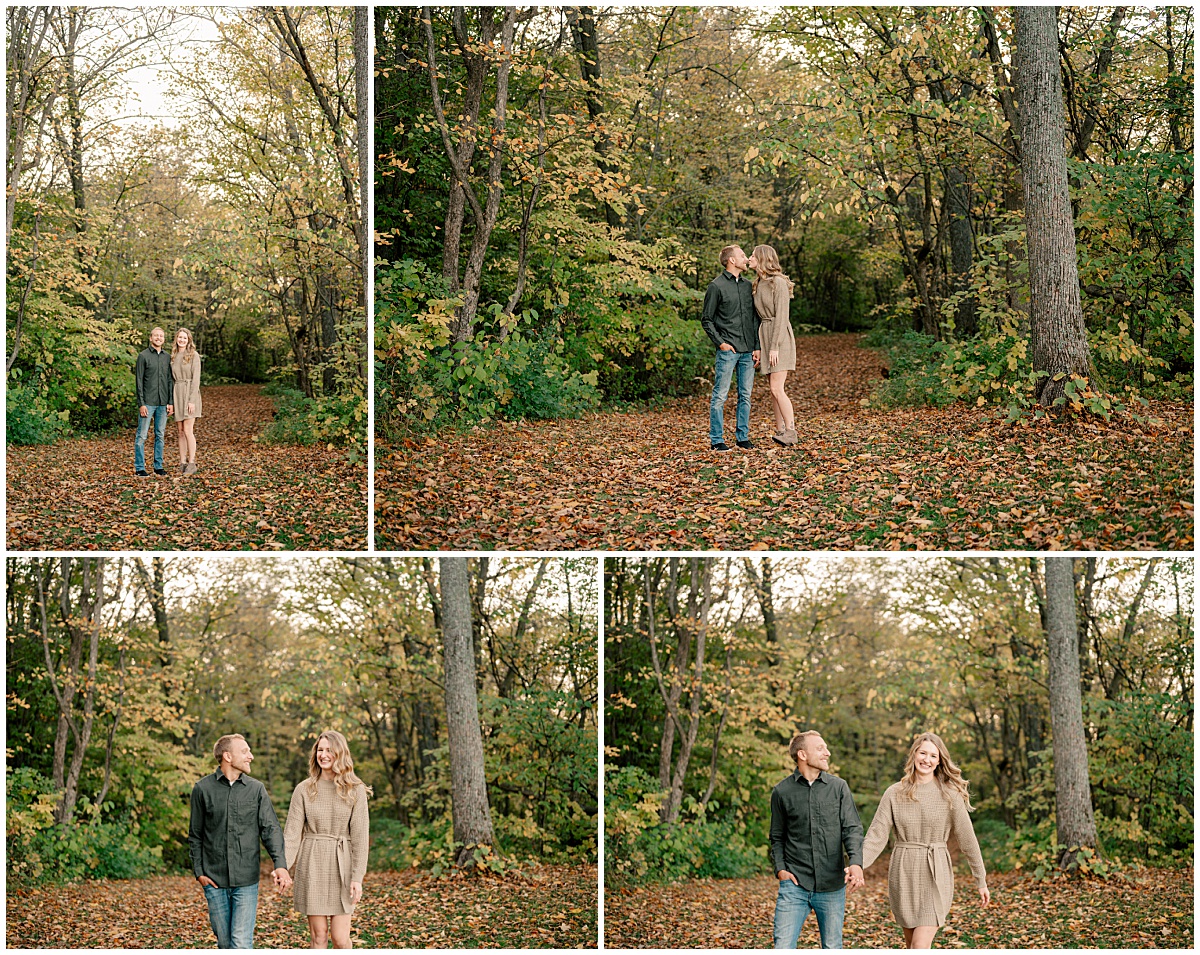 man and woman hold hands as they walk through woods during Fall Engagement at Mississippi River