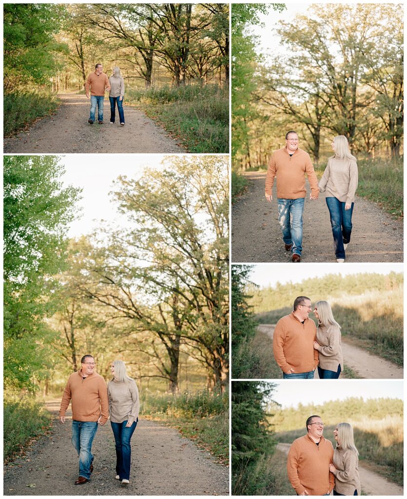 engaged couple holds hands walking down path by Rule Creative Co