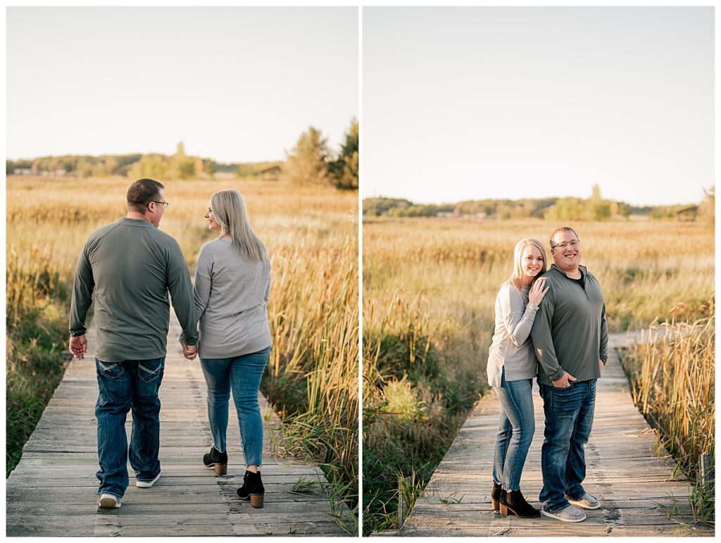 fiancées stroll down dock holding hands by Minnesota engagement photographer