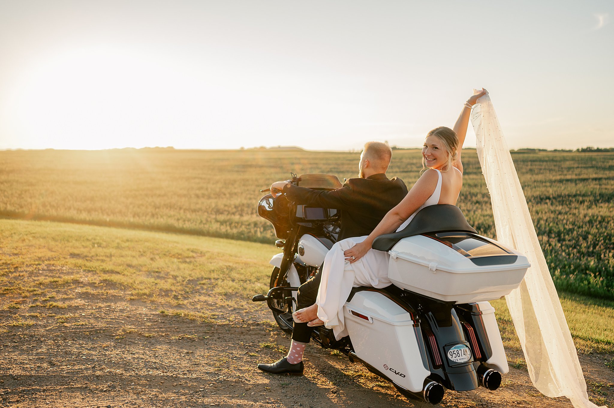 photog shares the 10 tools I couldn't live without as a wedding photographer as couple rides off into the sunset on motorcycle