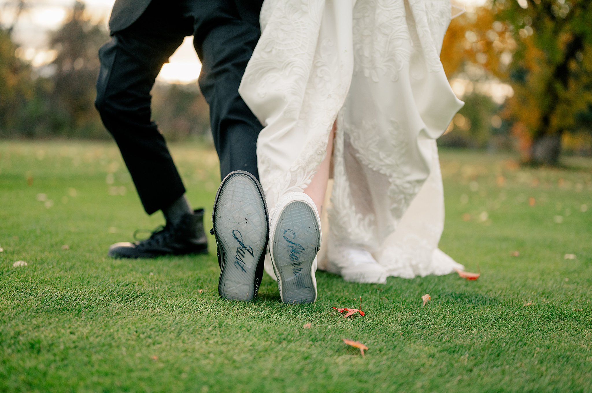 bride and groom show of bottom of insoles as photog shares the 10 tools I couldn't live without as a wedding photographer