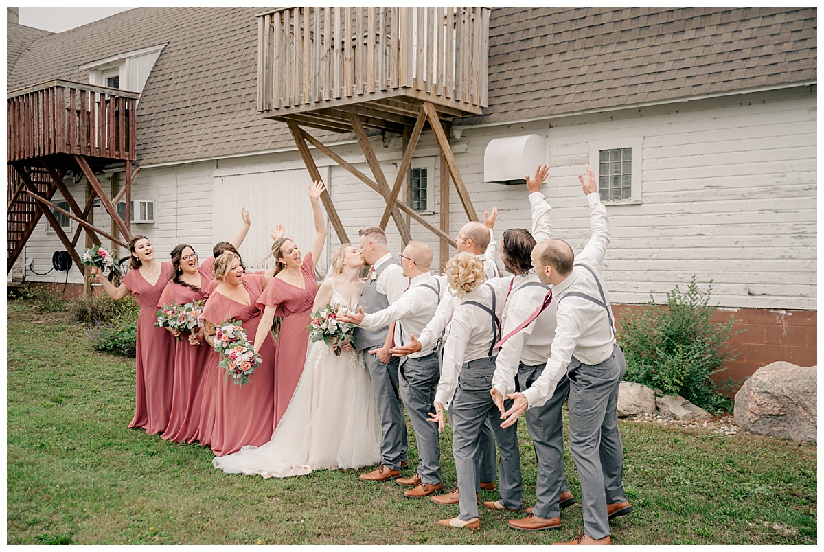 becoming an exceptional shooter is capturing wedding party celebrating a kiss