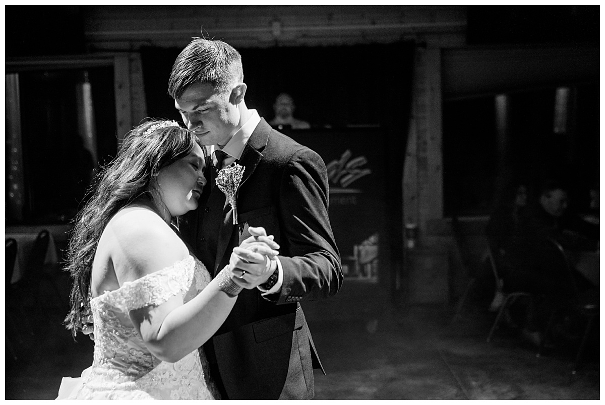 newlyweds have first dance together by Minnesota wedding photographer