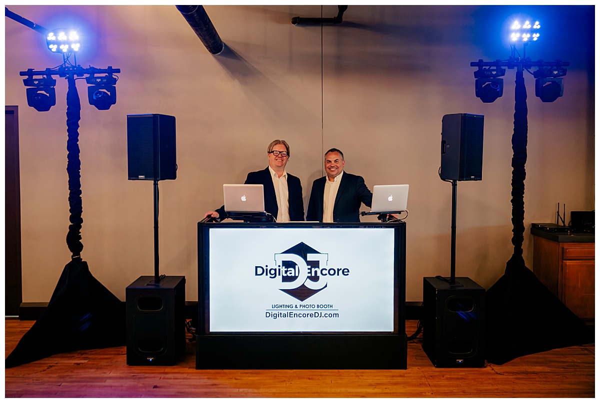 DJs stand at booth ready with lighting at Minnesota Wed Magazine launch