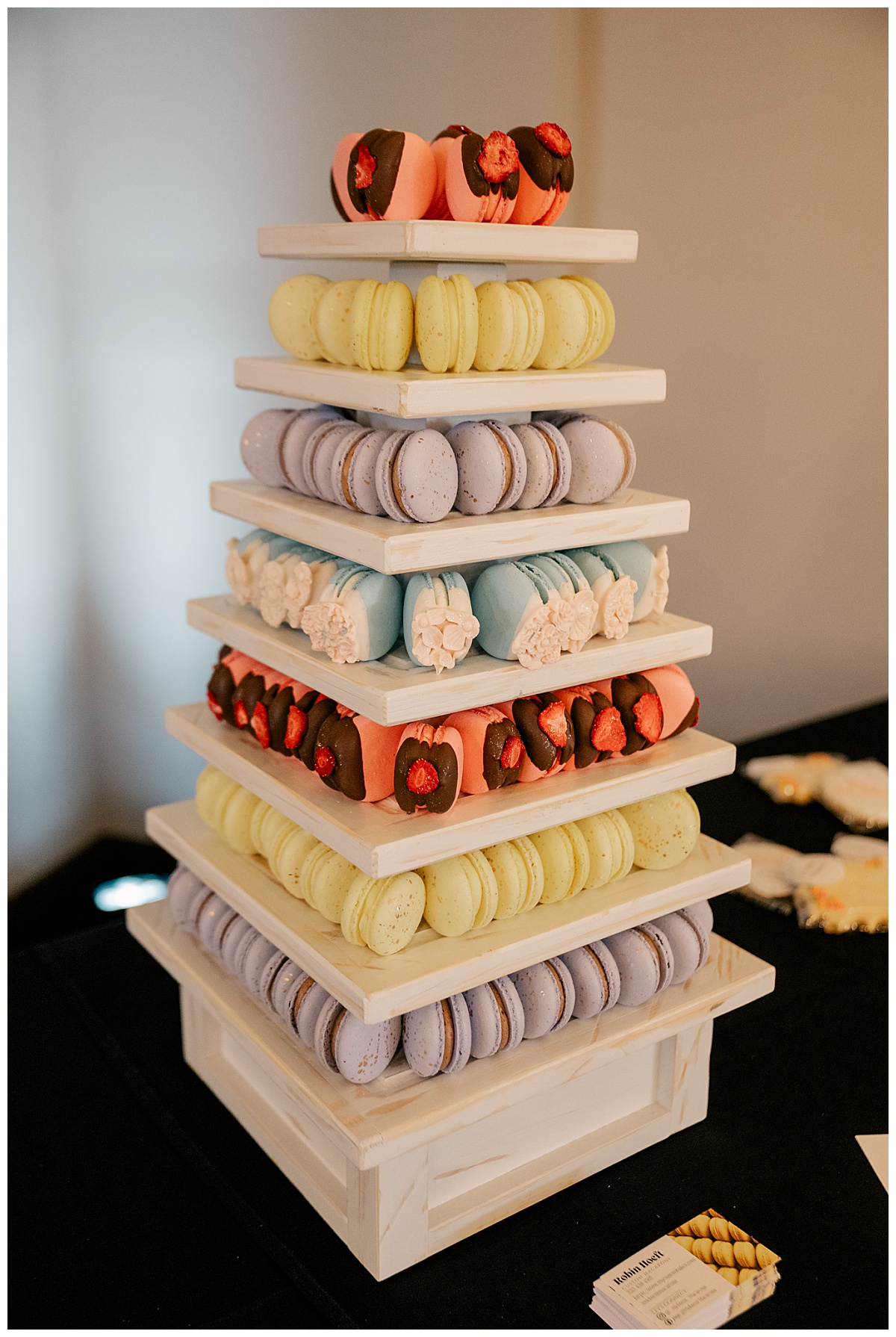 macarons stacked high on tower by Rule Creative Co