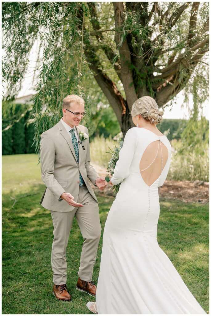 groom sees his bride for the first time by Minnesota wedding photographer