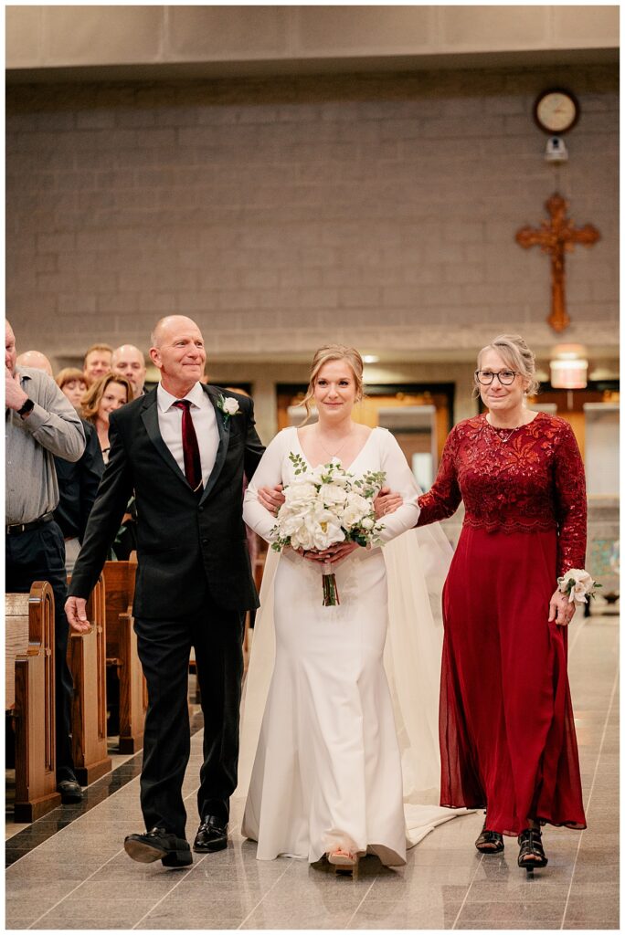 bride walked down aisle by mom and dad by Rule Creative Co