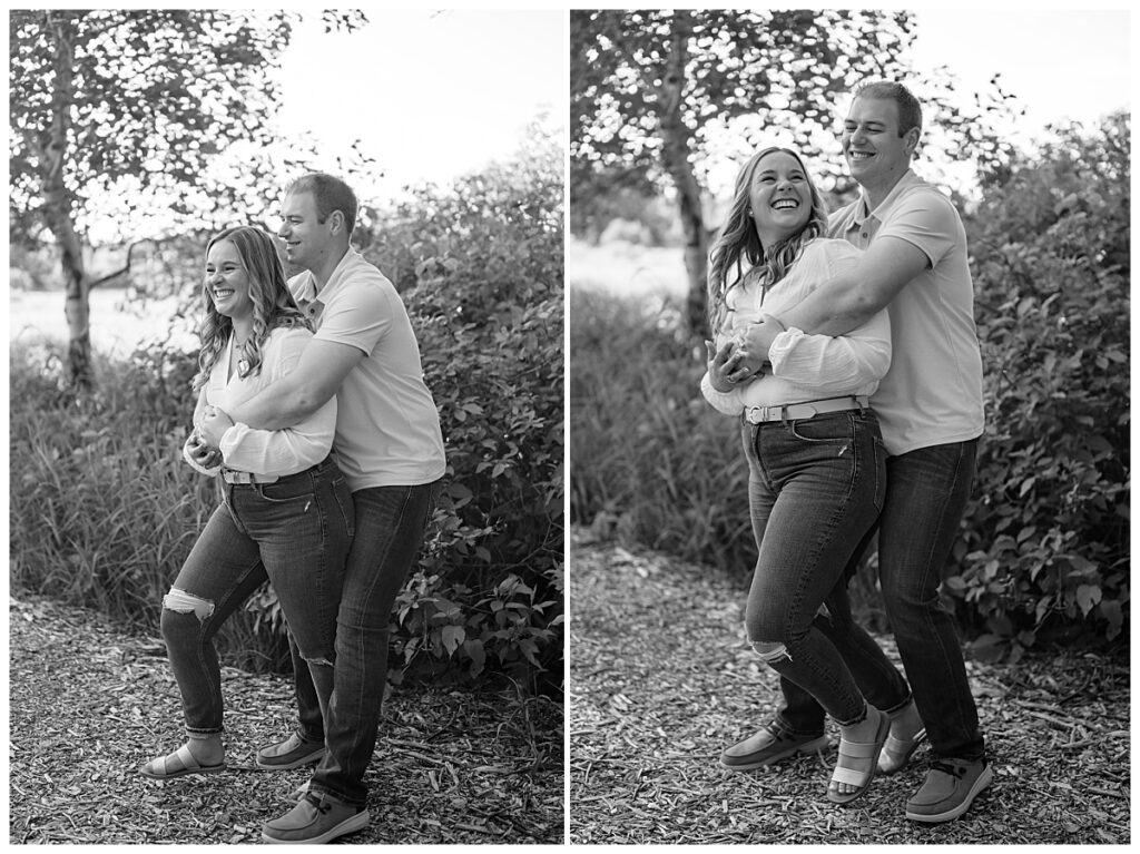 man wraps arms around woman during engagement session by Minnesota wedding photographer