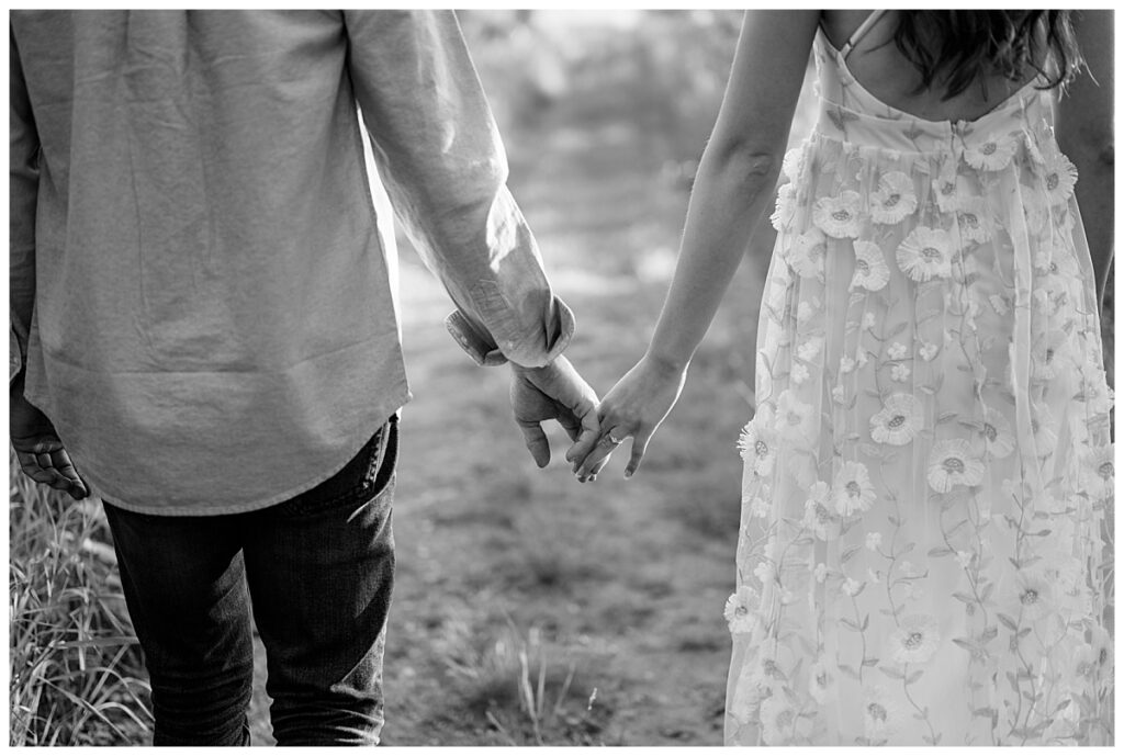 couple holds hands by Minnesota wedding photographer