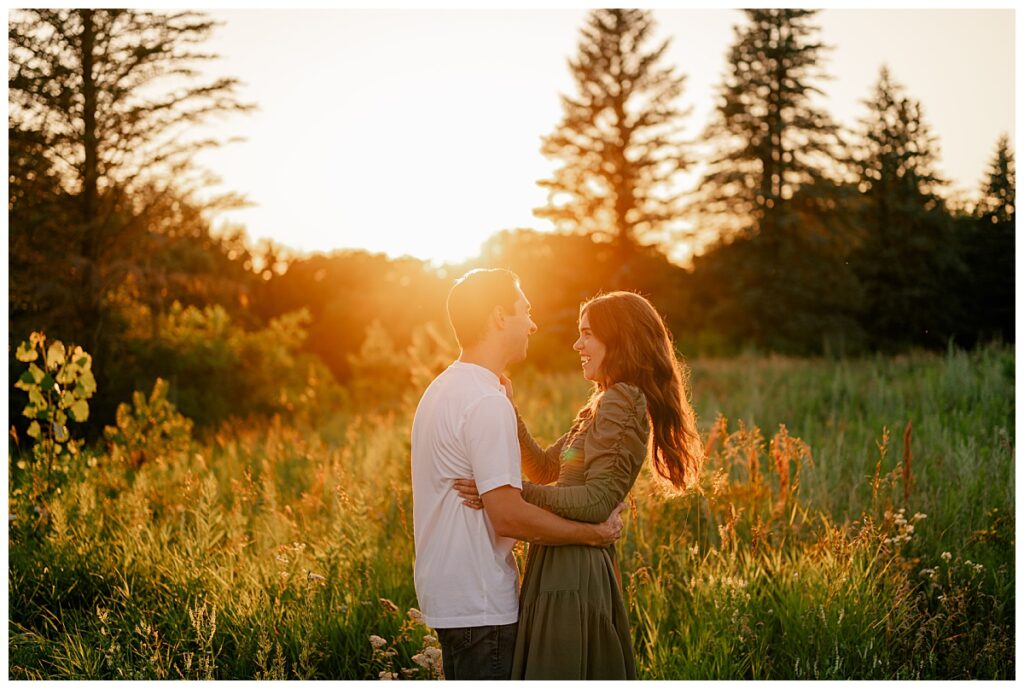 woman smiles at man by Minnesota wedding photographer