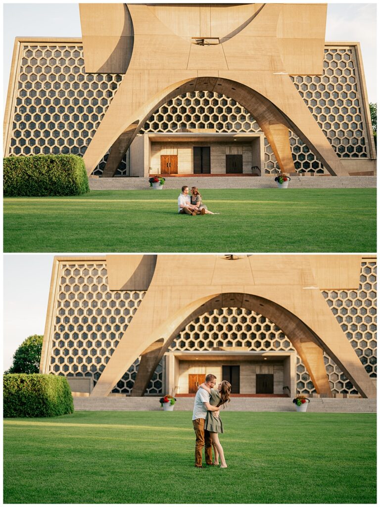 man and woman sit on lawn in front of honeycomb building during engagement at St. John's University