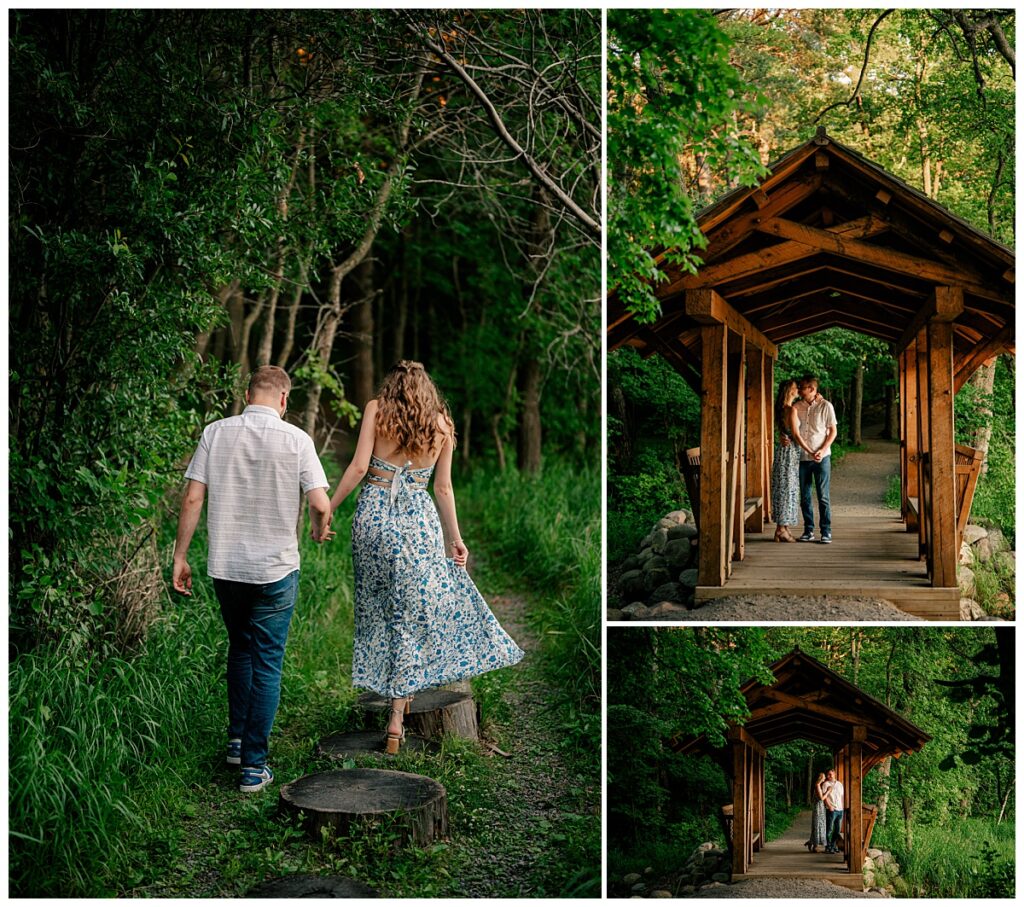 man holds woman's hand as she walks along tree stumps by Minnesota wedding photographer