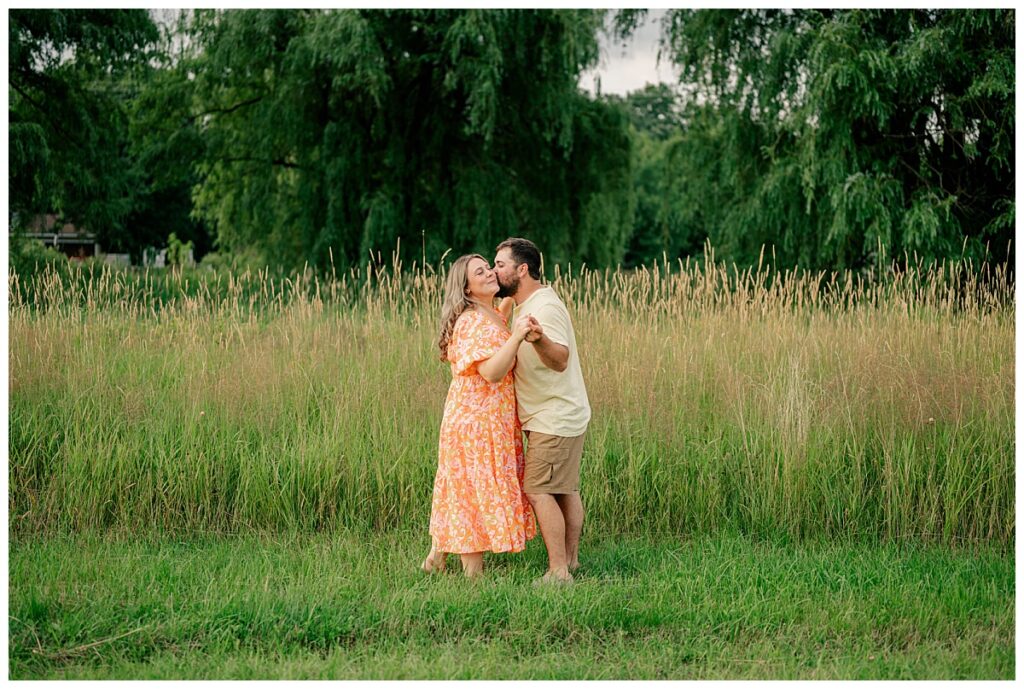 man kisses wife on the cheek by Minnesota photographer