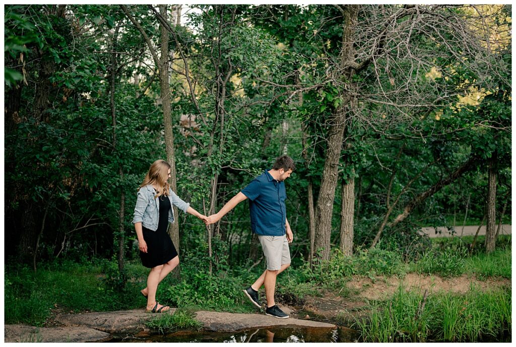 bride to be is led by groom to be along rocks by Rule Creative Co