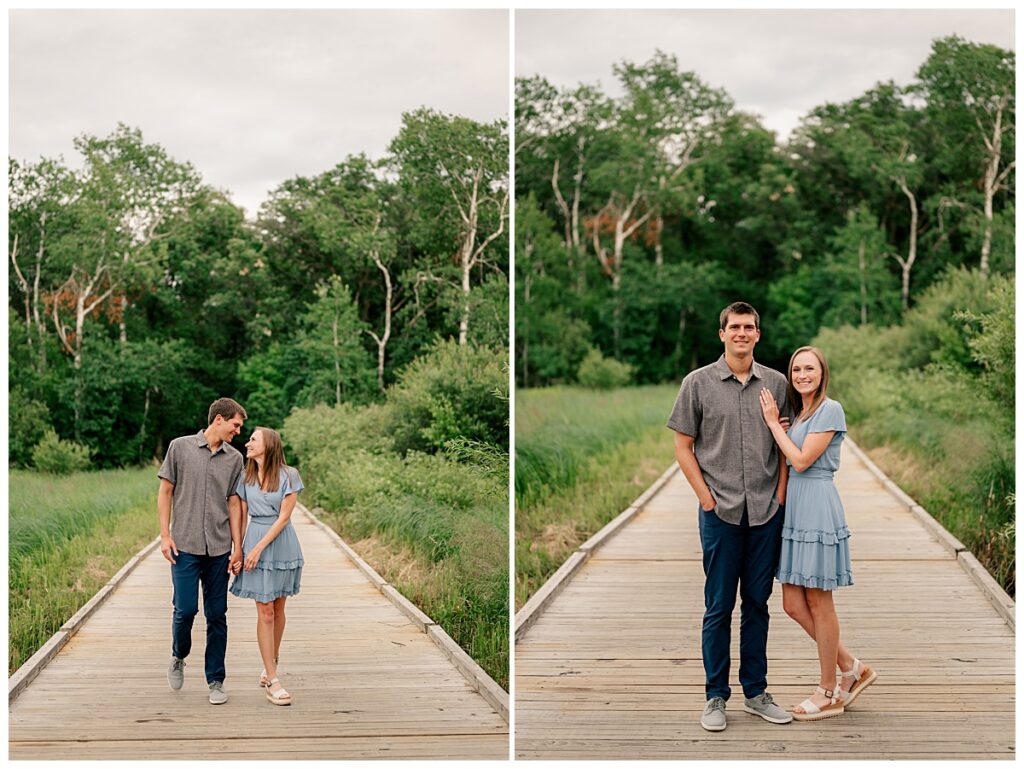 engaged couple walks hand in hand on boardwalk by Minnesota wedding photographer