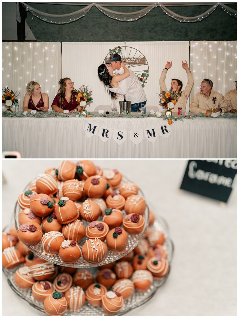 couple kisses at head table at late summer Central Minnesota wedding