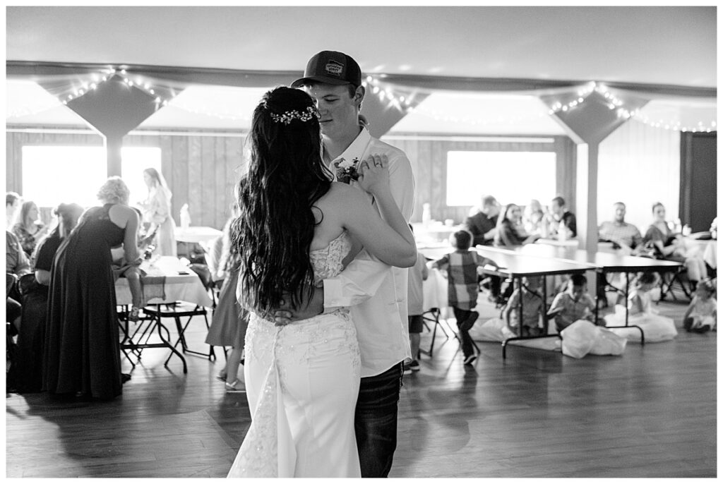 couple shares their first dance during their reception by Minnesota wedding photographer