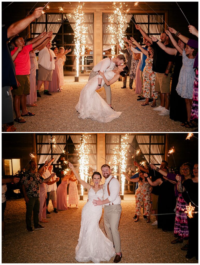 man dips woman to kiss her as guests hold sparklers by Minnesota wedding photographer