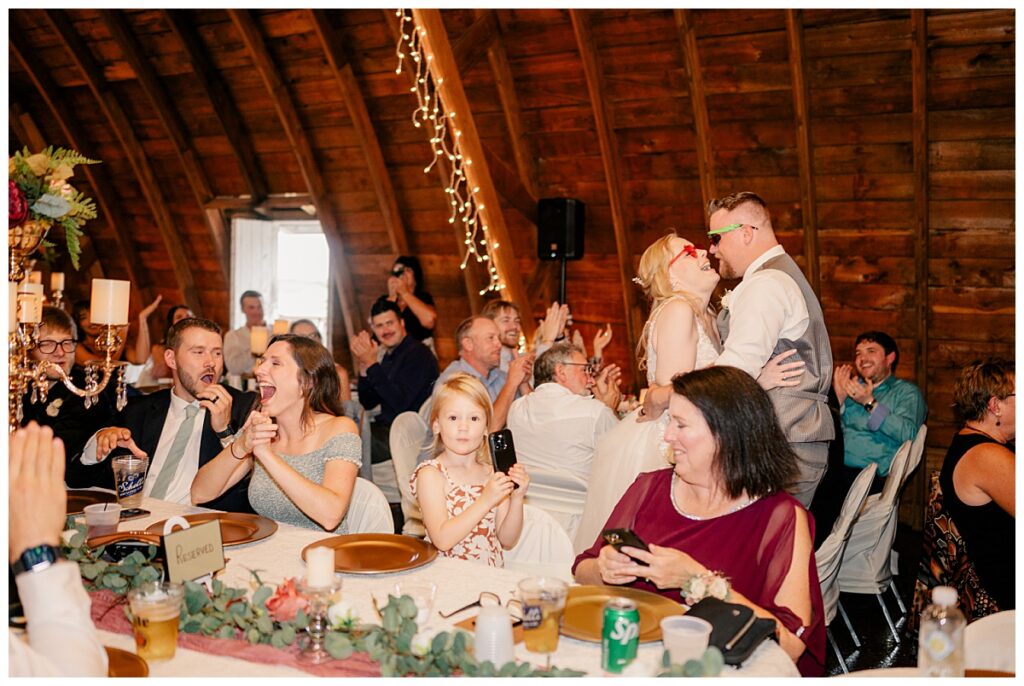 bride and groom laugh and have fun with guests during reception by Rule Creative Co