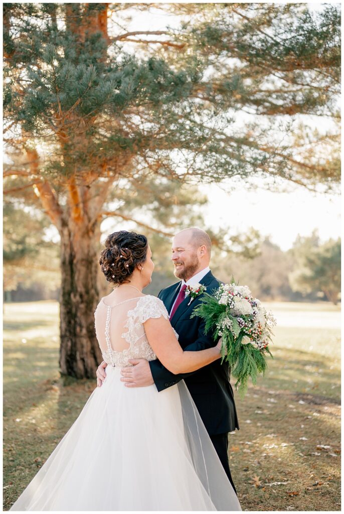 couple looks into each other's eyes as they consider why your wedding timeline matters 