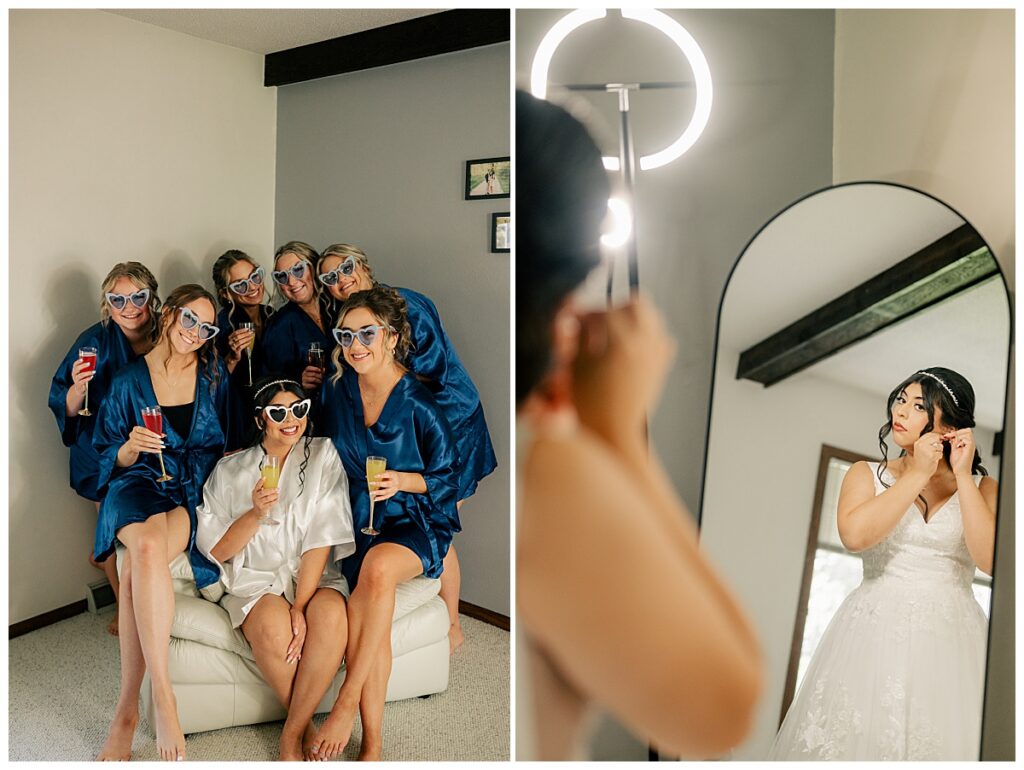 bride puts in earrings while she looks in arched mirror by Rule Creative Co