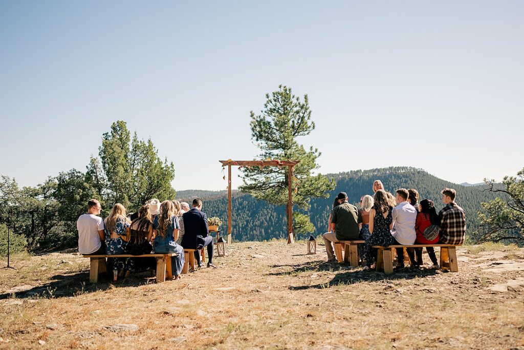 outdoor ceremony set up with wooden arch by Rule Creative Co