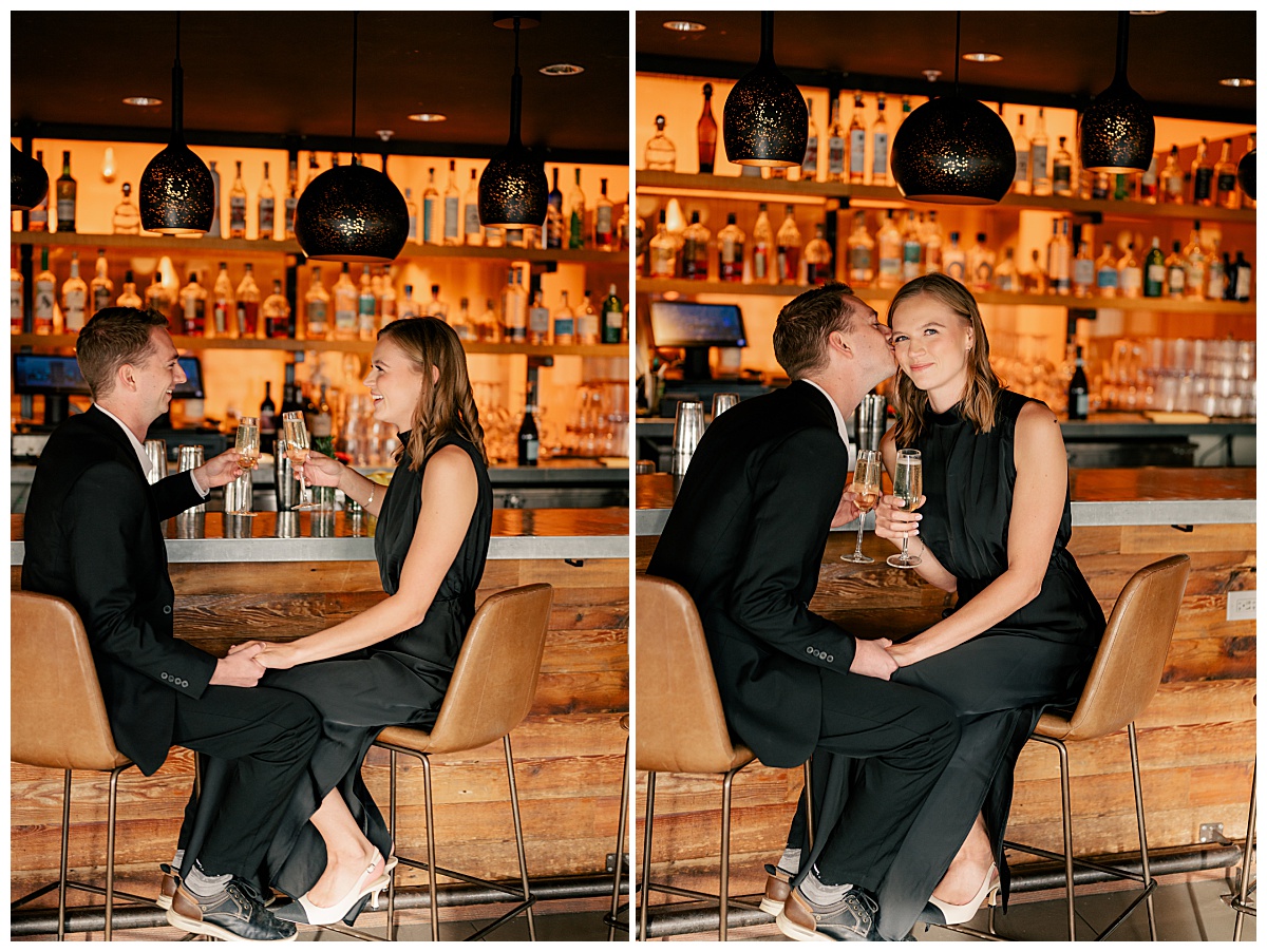 woman holding glass of champagne at bar by Rule Creative Co