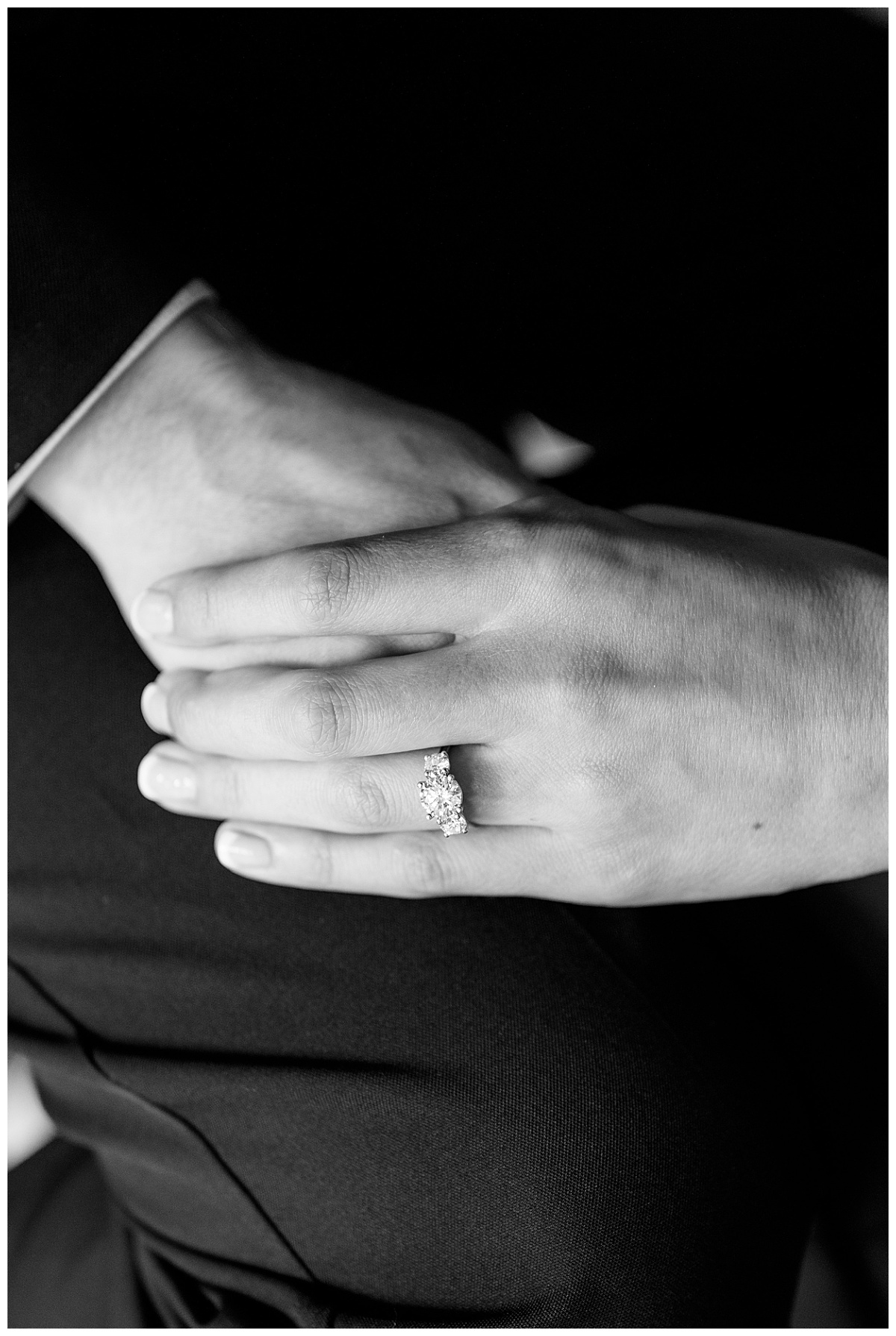 two hands with diamond ring holding each other at Hewing Hotel