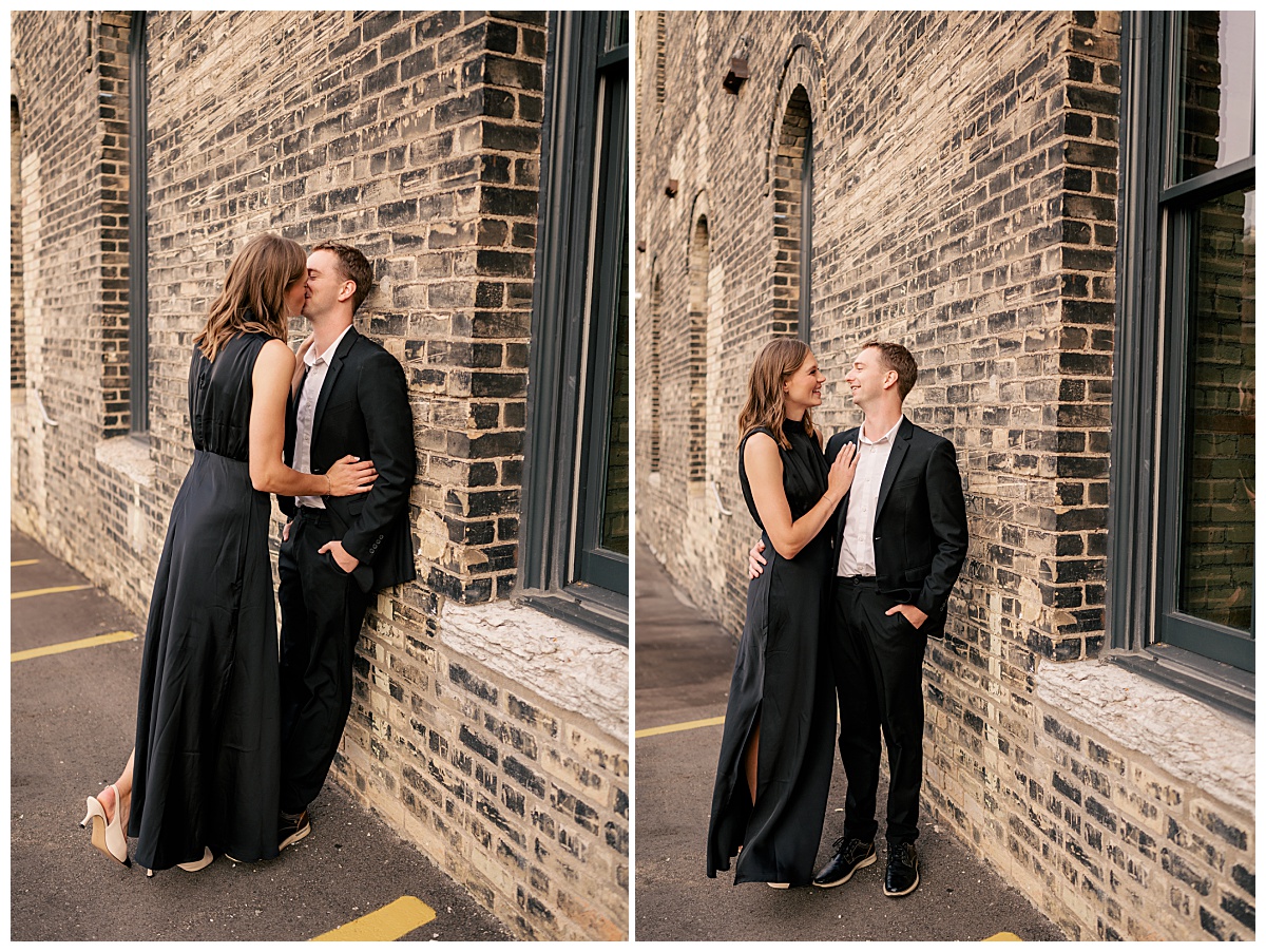 couple in black attire lean against brick wall by Rule Creative Co