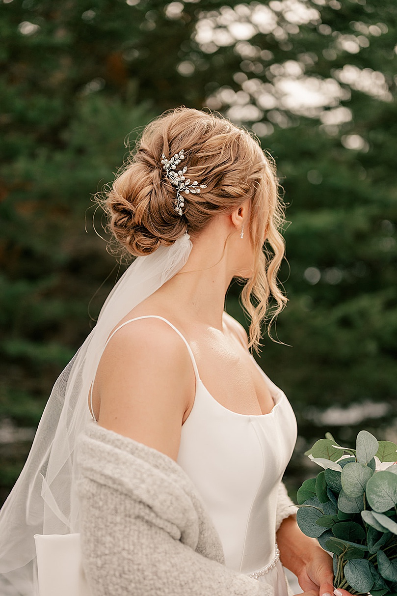 blonde woman's updo with diamond barrette by Minnesota wedding photographer