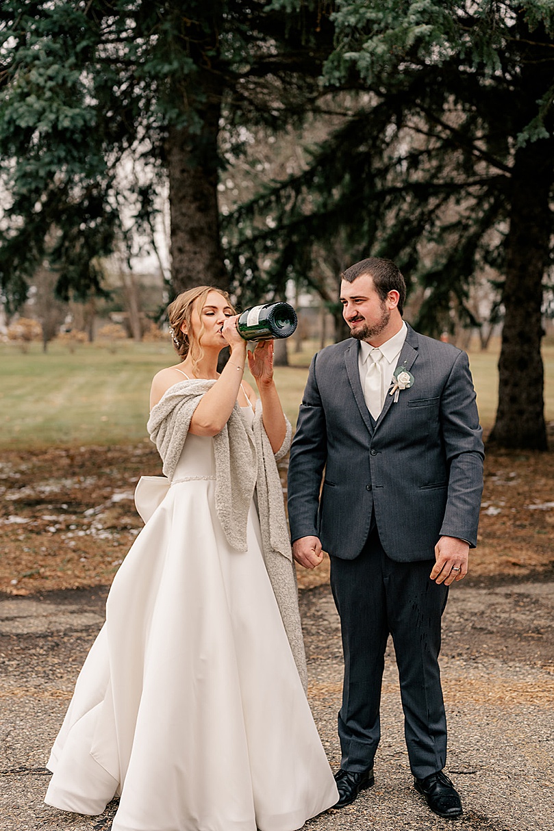 bride chugs champagne before ceremony by Rule Creative Co