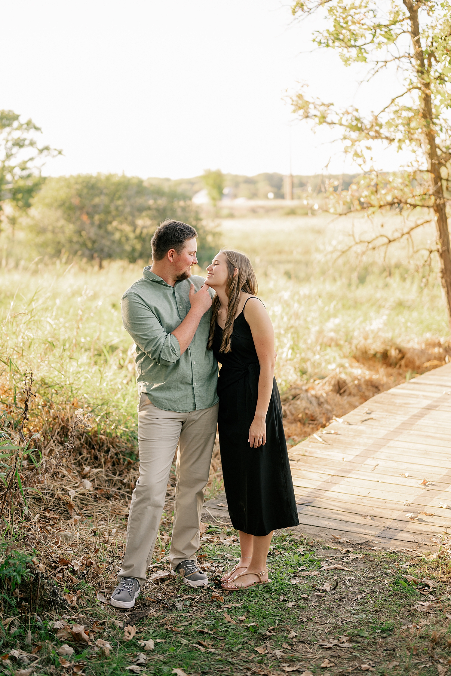 couple in a field for beautiful Fall engagement session