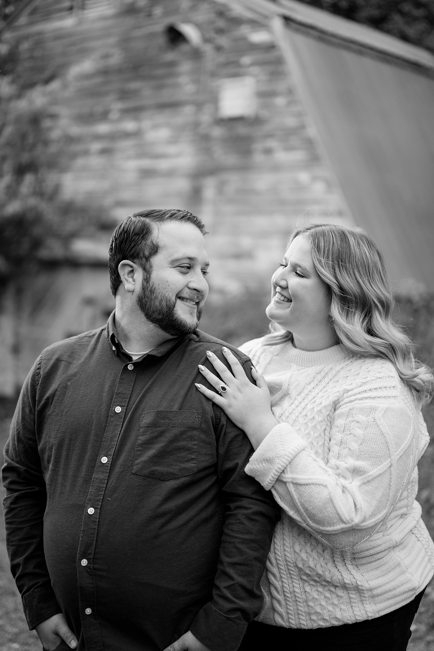 man looks back at his fiance in love by Minnesota wedding photographer 