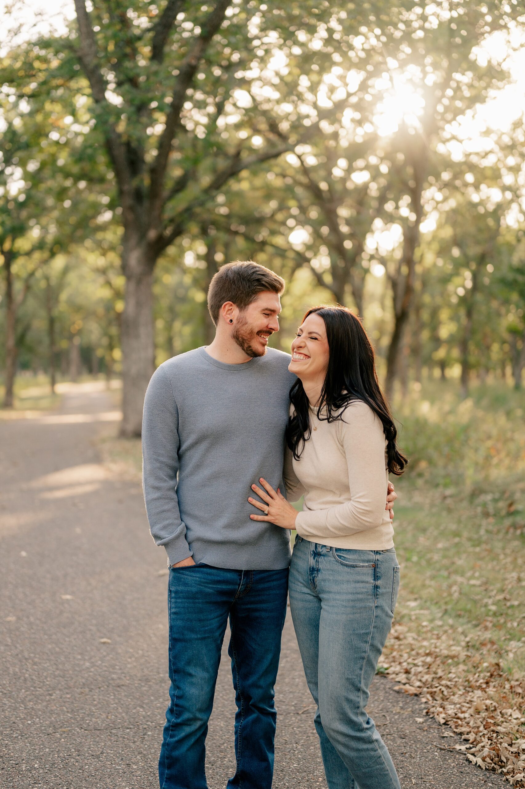 Couple laughs and hugs during golden hour with Rule Creative Co.