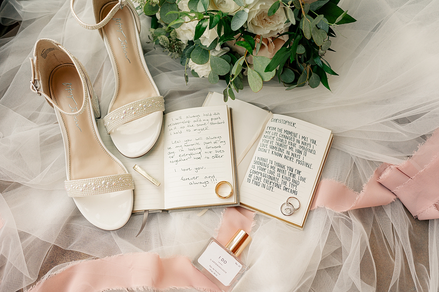 vow books open on tulle by Minnesota elopement photographer