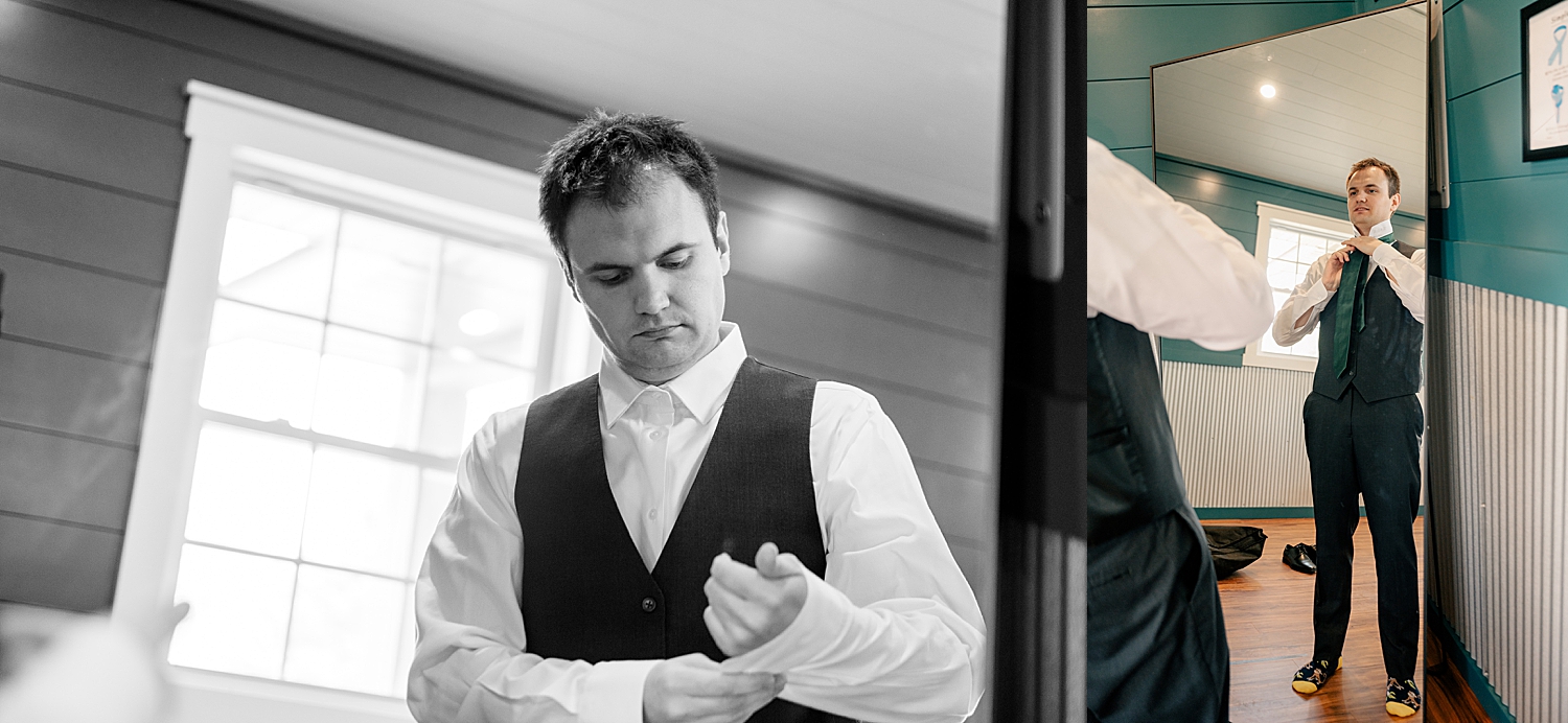 groom gets tie on in front of mirror by Minnesota wedding photographer