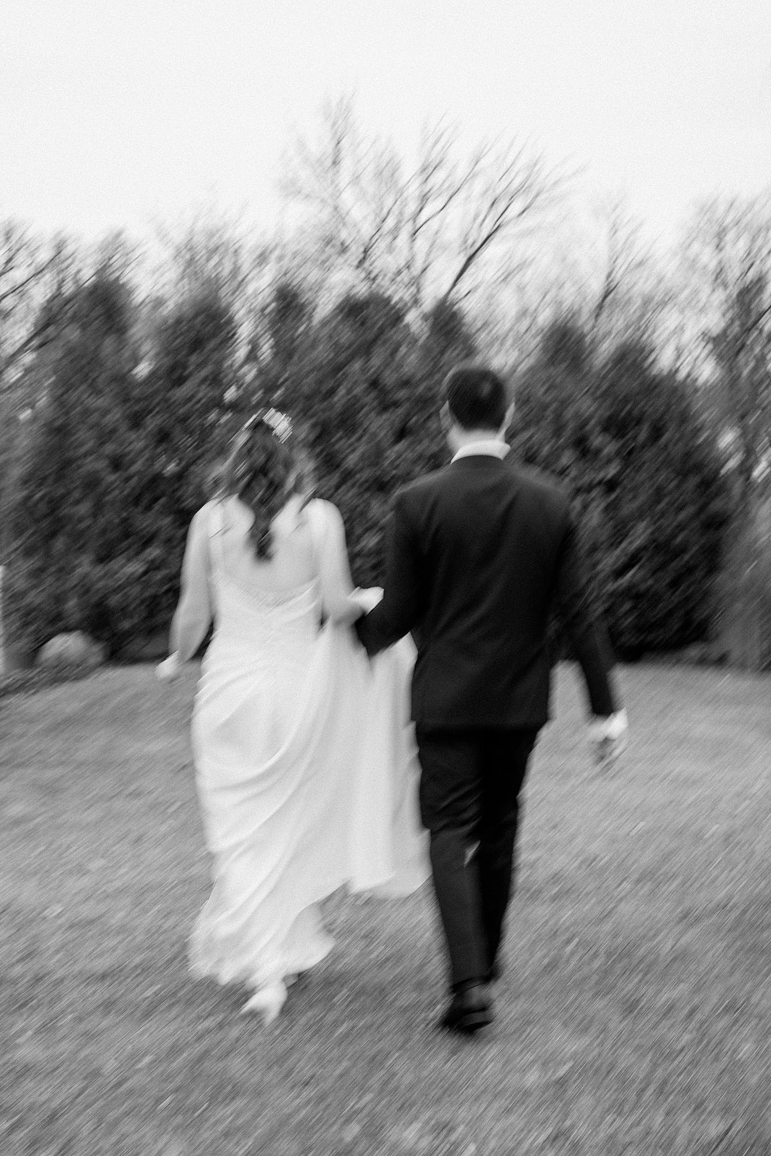 bride and groom walk through garden at Kilkarney Hills Golf Course