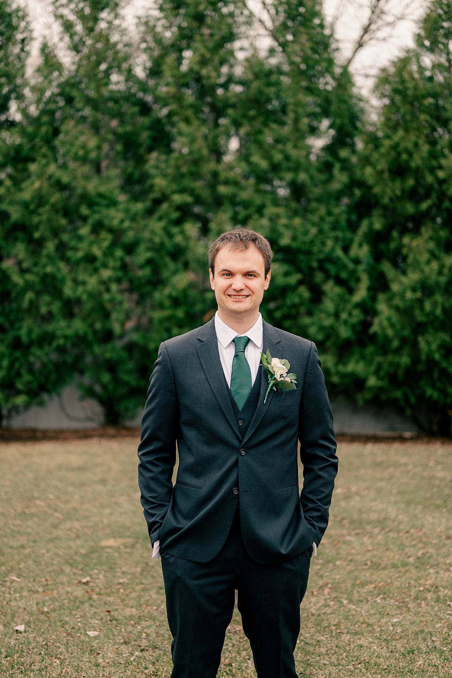 groom with green tie in garden at Kilkarney Hills Golf Course