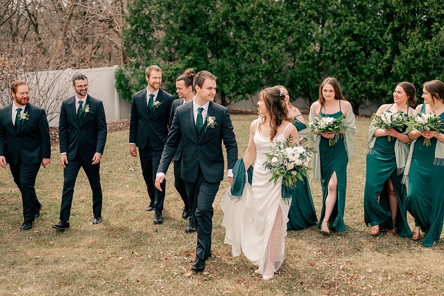 newylweds walk with their bridal party by Rule Creative Co