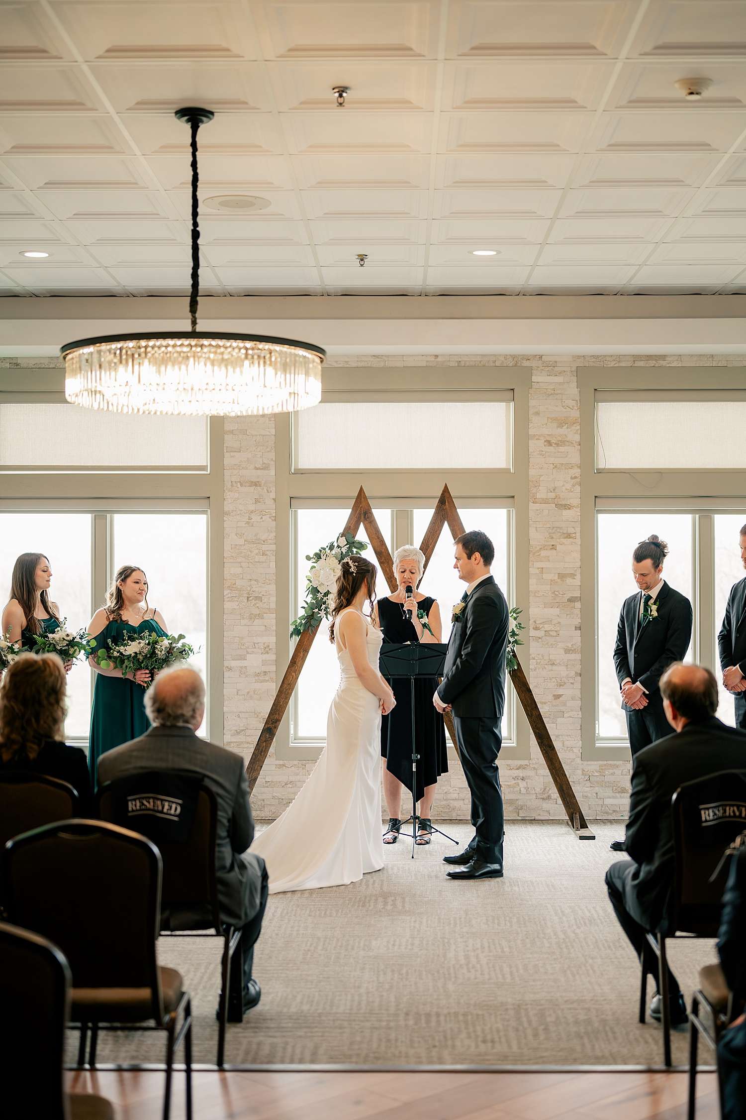 couple stands at alter to say I do at Kilkarney Hills Golf Course