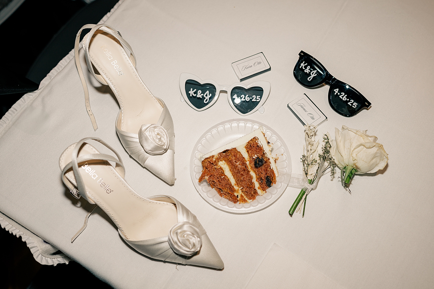 cake, flowers and sunglasses on table by Rule Creative Co