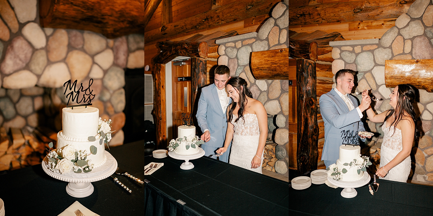 husband and wife feed each other cake at The Grands at Mulligan
