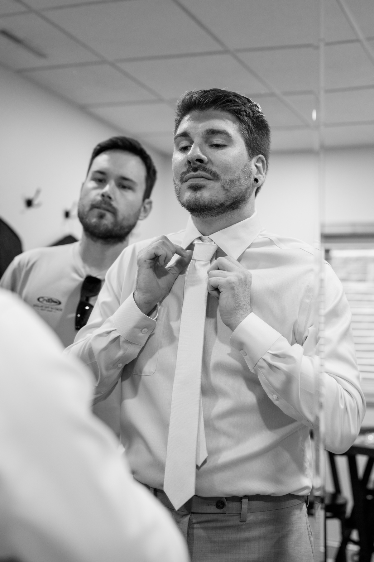 Groom getting ready for vibrant summer wedding