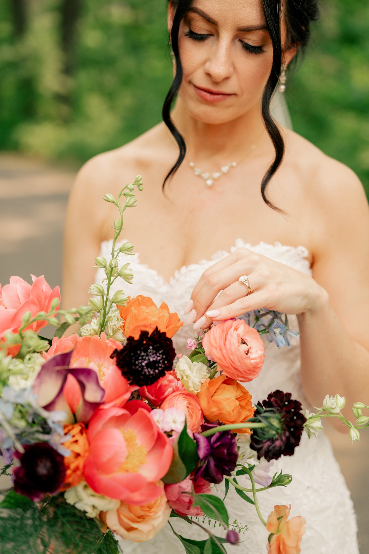 Bride holding colorful bouquet for vibrant summer wedding