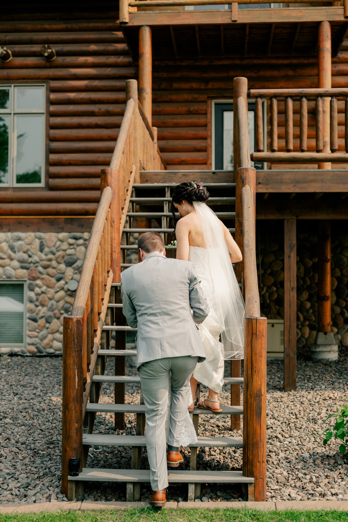 Newlyweds walking away from ceremony by Rule Creative Co