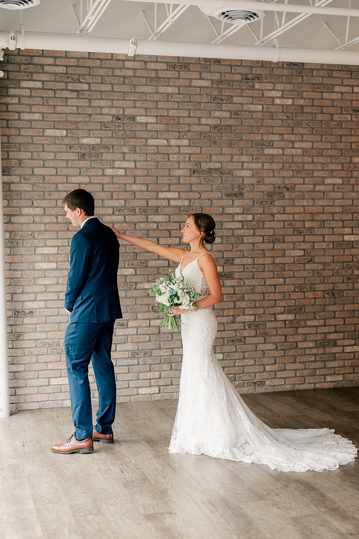 Photo of bride and groom having first look by Minnesota Wedding Photographer