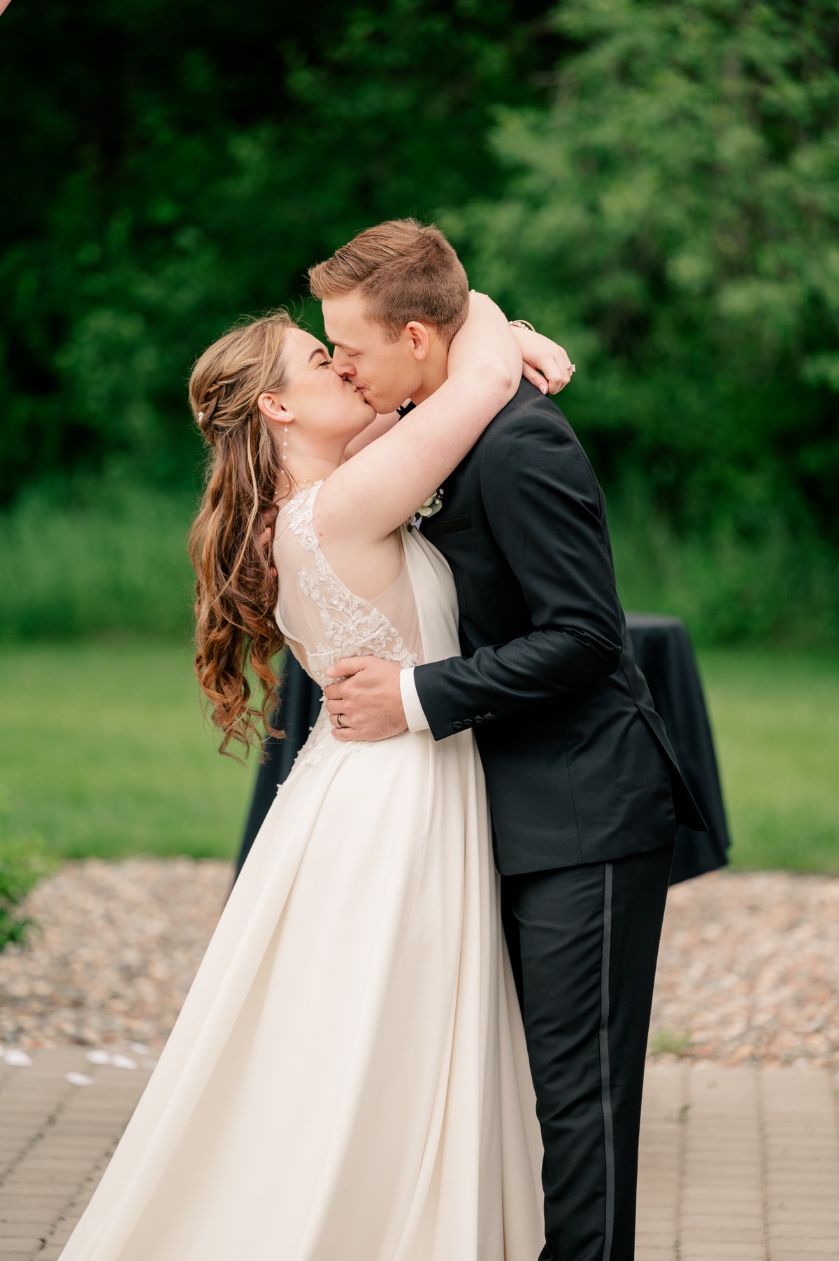 Newlyweds share their first kiss during ceremony by Rule Creative Co