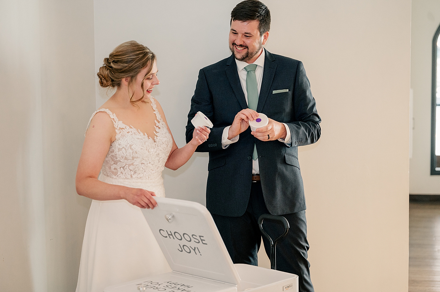 newlyweds pick out ice cream from a cart by Rule Creative Co