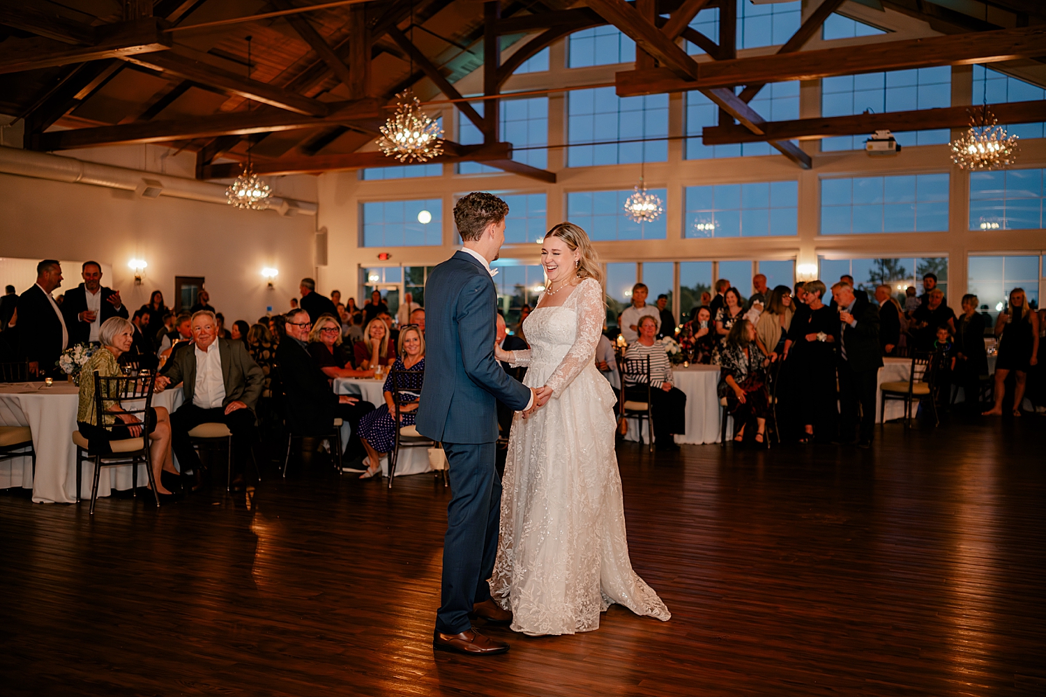 bride giggles with her groom on the dance floor by Rule Creative Co